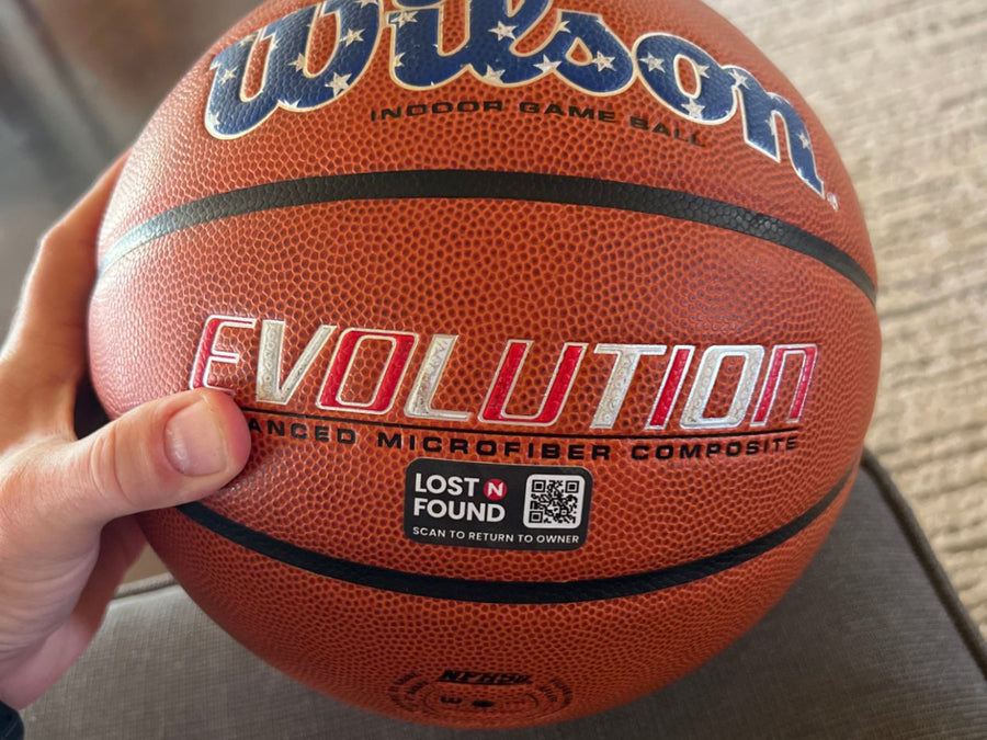 Kids' basketball with a Lost N Found QR return tag